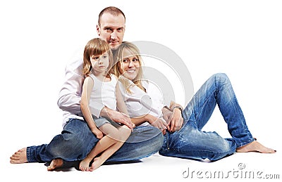 Father, mother and daughter sit on floor