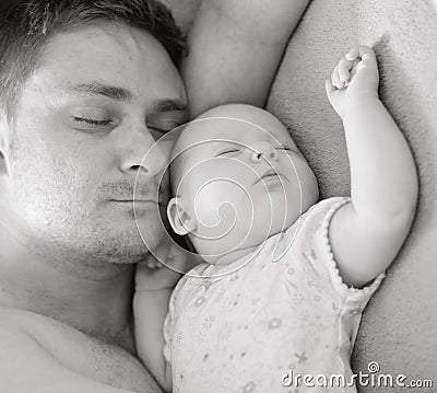 Father sleep with baby.