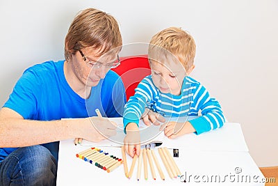 Father and son drawing together