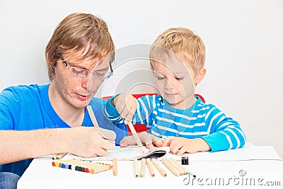 Father and son drawing together