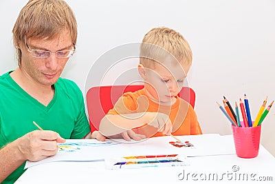 Father and son drawing together