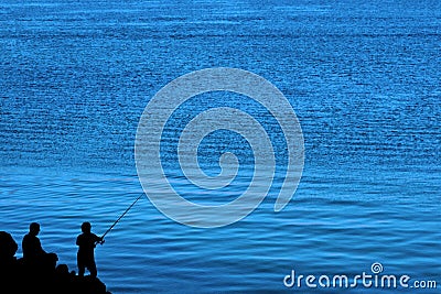 Father and son fishing silhouette