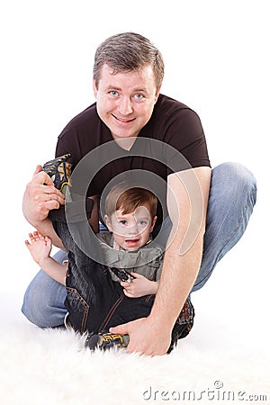 Father and son. Middle-aged man playing with boy