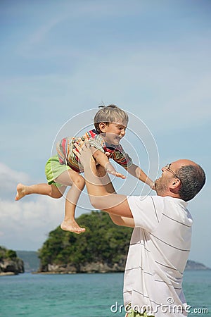 Father and son on natural background