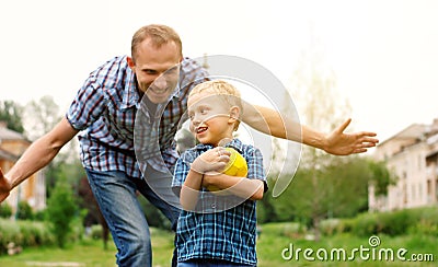 Father and son playing