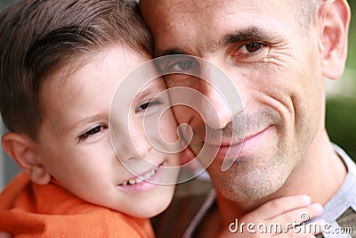 Father and son portrait smiling