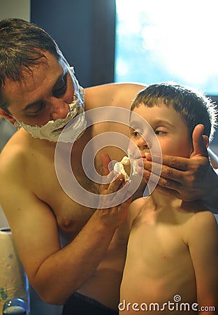 Father and Son Shaving in Bathroom