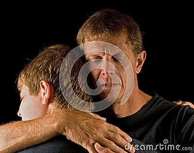 Father and son, tearful embrace