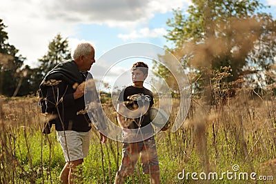 Father and son walking in a field