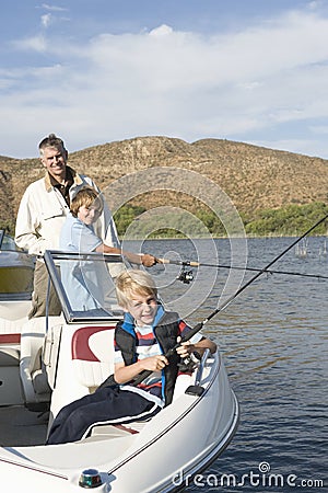 Father And Sons Fishing From A boat