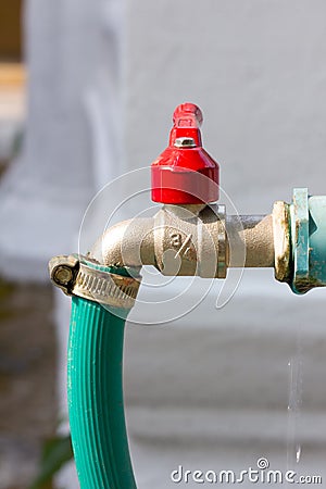 Faucet with green rubber tube