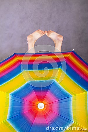 Feet & rainbow umbrella