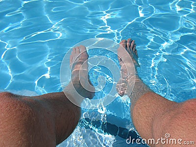 Feet Relax in Pool Water