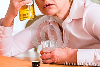 Female alcoholic drinking hard liquor