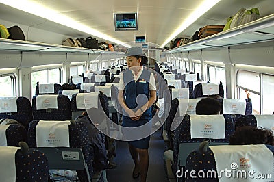 Female attendant in train, China