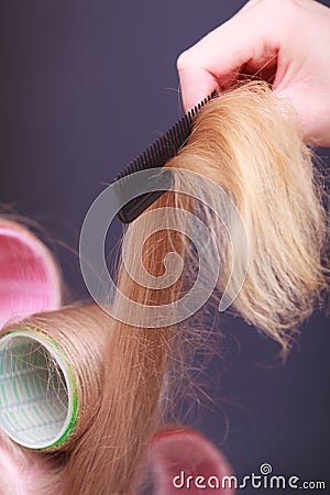 Female blond hair head curlers rollers hairdresser beauty salon