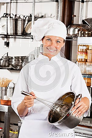 Female Chef With Wire Whisk And Mixing Bowl