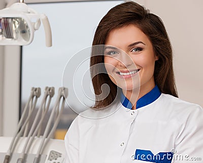 Female dentist at dentist s surgery