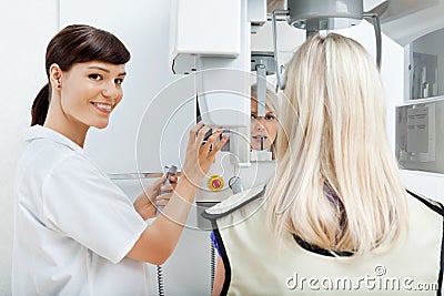 Female Dentist Getting Her Patient s Teeth X-Rayed