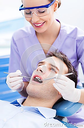 Female dentist and patient in dentist office