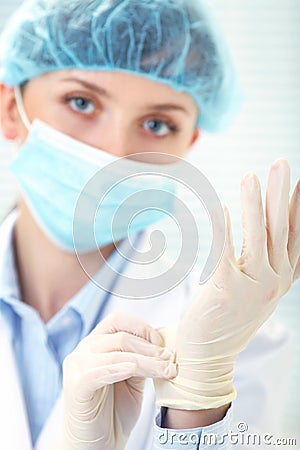 Female doctor in medical gloves
