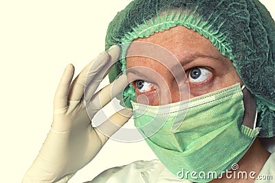 Female doctor with protective mask thinking