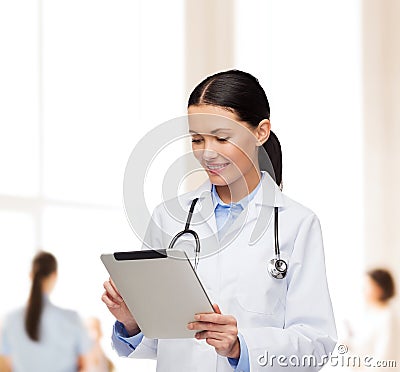 Female doctor with stethoscope and tablet pc