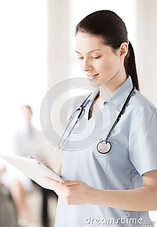 Female doctor with tablet pc