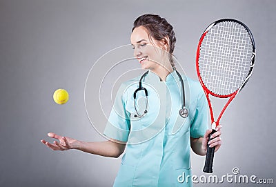 Female doctor with a tennis racket