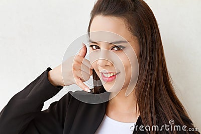 Female executive with hand sign of phone contact