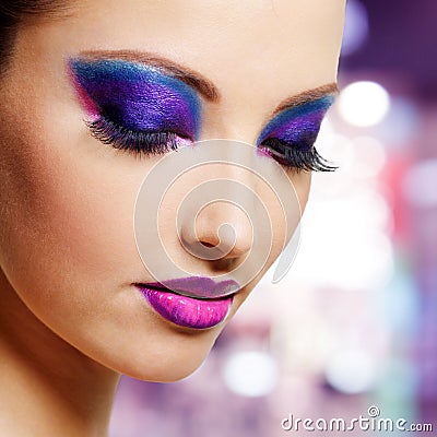 Female face with purple fashion makeup