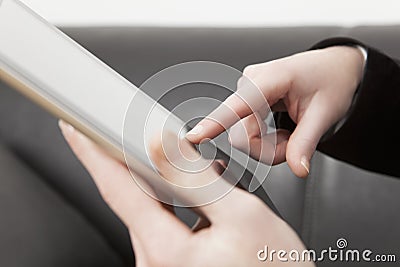 Female finger on tablet PC