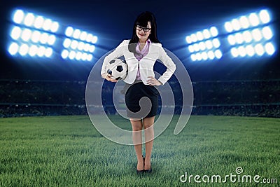 Female football manager at field