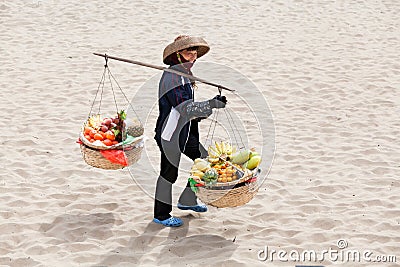 Female greengrocer fruit seller in Asia