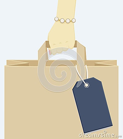 Female hand carrying a shopping paper bag