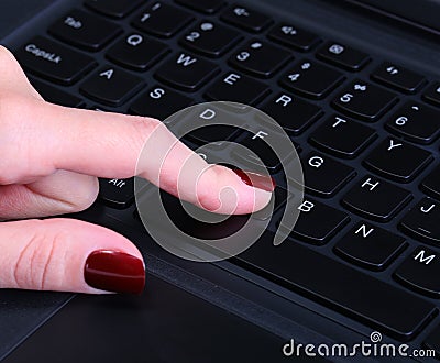 Female hand using computer keyboard