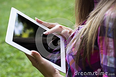 Female hands using a digital tablet PC