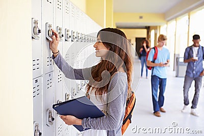 Female High School Student Opening Locker