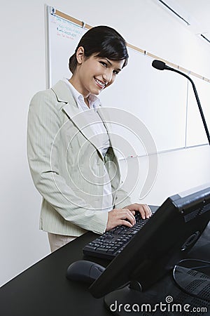 Female Lecturer Using Computer
