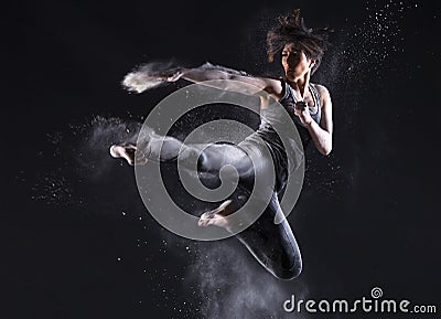 Female Martial Artist with Powder Jump Kick
