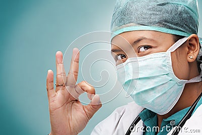 Female medical doctor with ok sign