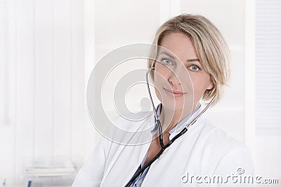Female medical doctor in white: Portrait on white background