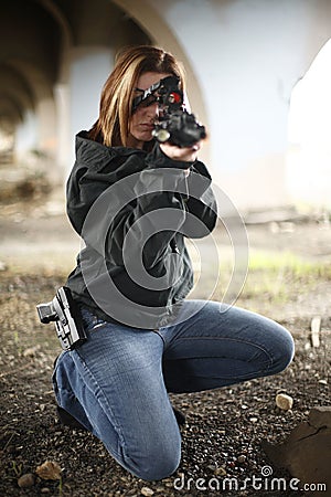 Female Officer aiming rifle