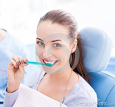 Female patient brushing her teeth