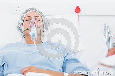 Female patient receiving artificial ventilation