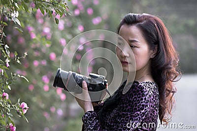 A female photographer in sunshine