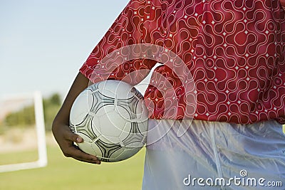 Female Player Holding Soccer Ball