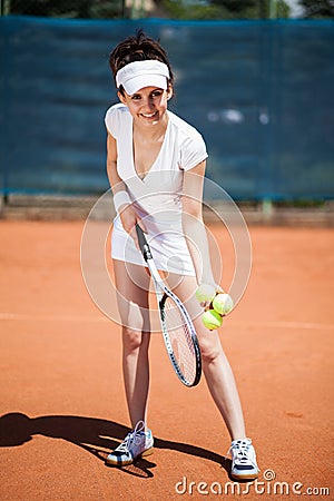 Female playing tennis