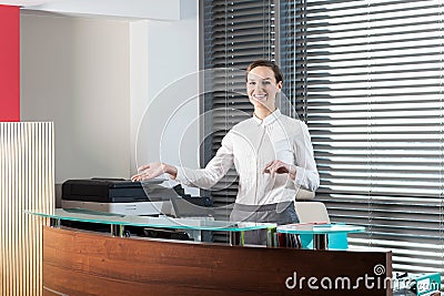 Female receptionist showing welcome gesture