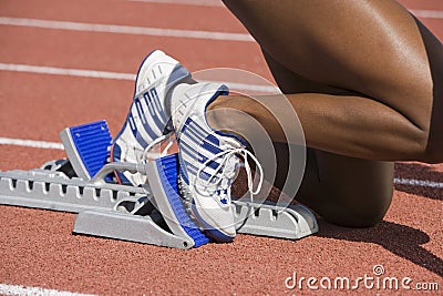 Female Runner On Starting Blocks